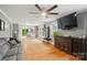 Spacious living room with hardwood floors and an open layout to dining and kitchen areas at 1209 Rainbow Dr, Kannapolis, NC 28081