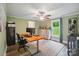 Office space featuring hardwood floors, a ceiling fan, and a large window at 1209 Rainbow Dr, Kannapolis, NC 28081