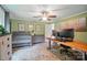Comfortable office space with desk, crib, and hardwood floors at 1209 Rainbow Dr, Kannapolis, NC 28081