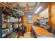 Functional shed interior with shelving, workbench, and storage for gardening supplies at 1209 Rainbow Dr, Kannapolis, NC 28081
