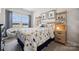Bright bedroom with dinosaur themed bedding, decor, and lots of natural light from large windows at 1217 Margo Mannor Dr, Fort Mill, SC 29708
