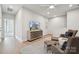 Inviting bonus room with neutral decor, modern lighting and comfortable seating arrangement at 1217 Margo Mannor Dr, Fort Mill, SC 29708