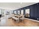 Open-concept dining area with stylish seating, wood flooring, and modern décor at 1217 Margo Mannor Dr, Fort Mill, SC 29708
