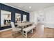 Elegant dining area with stylish seating, wood flooring, and modern décor at 1217 Margo Mannor Dr, Fort Mill, SC 29708