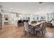 Open-concept kitchen and dining area featuring a center island, modern appliances, and wood flooring at 1217 Margo Mannor Dr, Fort Mill, SC 29708