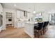 Bright kitchen features a center island with bar seating, stainless hood, and stylish pendant lighting at 1217 Margo Mannor Dr, Fort Mill, SC 29708