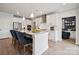 Bright kitchen features a center island with bar seating, stainless hood, and modern cabinetry at 1217 Margo Mannor Dr, Fort Mill, SC 29708