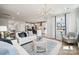 Bright and airy living room featuring a modern chandelier, neutral color palette and an open floorplan at 1217 Margo Mannor Dr, Fort Mill, SC 29708
