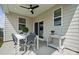 Cozy covered patio with outdoor dining set, ceiling fan, and sliding door access at 1217 Margo Mannor Dr, Fort Mill, SC 29708