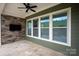 Covered patio features stone wall and tiled floor at 1244 Weir Ct, Fort Mill, SC 29708