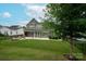 Beautiful backyard with patio, fire pit, and lush green lawn at 1244 Weir Ct, Fort Mill, SC 29708