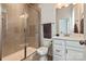 Beautiful bathroom featuring tiled shower with glass door, toilet, and vanity with mirror at 1244 Weir Ct, Fort Mill, SC 29708