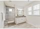 Bright bathroom showcases a glass shower, white vanity, and wood-look tile floor at 1244 Weir Ct, Fort Mill, SC 29708