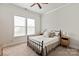 Bright bedroom with carpeted floor, double window, and a metal bed frame with side tables at 1244 Weir Ct, Fort Mill, SC 29708