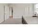 Spacious carpeted bedroom featuring a doorway, closet, and ample natural light at 1244 Weir Ct, Fort Mill, SC 29708
