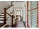 Grand foyer featuring hardwood floors, a staircase, and a view into the dining room at 1244 Weir Ct, Fort Mill, SC 29708
