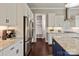 Elegant kitchen with white cabinetry, stainless steel appliances, and granite countertops at 1244 Weir Ct, Fort Mill, SC 29708