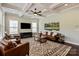 Spacious living room with a coffered ceiling and modern decor creating an inviting space at 1244 Weir Ct, Fort Mill, SC 29708