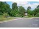 Community walking path with signage, bench seating, and convenient parking at 1244 Weir Ct, Fort Mill, SC 29708