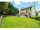 Beautiful backyard with lush green lawn, mature trees, and an inviting patio area at 147 Whitley Mills Rd, Fort Mill, SC 29708