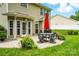 Inviting backyard featuring a patio, outdoor dining set, and mature greenery at 147 Whitley Mills Rd, Fort Mill, SC 29708