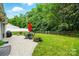 Lush backyard with patio area, outdoor seating, grill, and well-maintained landscaping at 147 Whitley Mills Rd, Fort Mill, SC 29708