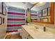 Bathroom with vanity, mirror, and a shower-tub combo with striped shower curtain at 147 Whitley Mills Rd, Fort Mill, SC 29708