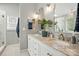 Primary bathroom with marble countertops, dual sinks, and decor accents at 147 Whitley Mills Rd, Fort Mill, SC 29708
