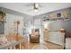 Serene Bedroom with crib, rocker, dresser, and decorative shelving with books at 147 Whitley Mills Rd, Fort Mill, SC 29708