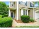 Charming home entrance with a teal door, neat landscaping, and tasteful exterior details at 147 Whitley Mills Rd, Fort Mill, SC 29708