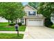 Charming two-story home with a well-maintained lawn, a two-car garage, and blue shutters at 147 Whitley Mills Rd, Fort Mill, SC 29708