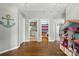 Open hallway with hardwood flooring leading to a bathroom, Bedroom, and bedroom at 147 Whitley Mills Rd, Fort Mill, SC 29708