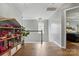 Upstairs hallway with wood floors, gray walls, decorative lighting leading to a bedroom at 147 Whitley Mills Rd, Fort Mill, SC 29708