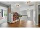 Upstairs hallway with wood floors, gray walls, decorative lighting and a dollhouse on display at 147 Whitley Mills Rd, Fort Mill, SC 29708