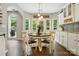 Kitchen nook features large bright windows, modern lighting and a decorative 'Let Your Joy Fill This House' sign at 147 Whitley Mills Rd, Fort Mill, SC 29708
