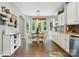 This spacious kitchen features a breakfast nook, stainless appliances, white cabinets and granite counters at 147 Whitley Mills Rd, Fort Mill, SC 29708