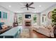 Comfortable living room with a fireplace, large windows, and stylish furnishings at 147 Whitley Mills Rd, Fort Mill, SC 29708