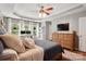 Spacious primary bedroom featuring a trey ceiling, a ceiling fan, and windows that provide natural light at 147 Whitley Mills Rd, Fort Mill, SC 29708