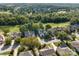 A high aerial shot shows the community surrounding a golf course with mature landscaping at 1525 Valhalla Dr, Denver, NC 28037