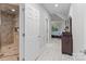 Elegant bathroom featuring a glass-enclosed shower with dual shower heads and stone-look tile at 1525 Valhalla Dr, Denver, NC 28037