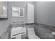 Modern powder room featuring a unique floating sink, contemporary mirror, and stylish accents at 1525 Valhalla Dr, Denver, NC 28037