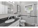 Bathroom featuring modern fixtures and a large mirror with vanity lighting at 1525 Valhalla Dr, Denver, NC 28037