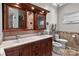 Bathroom featuring a double sink vanity with marble countertop and decorative tile accents at 1525 Valhalla Dr, Denver, NC 28037
