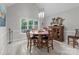 A dining area featuring a round wood table, wood chairs, and a light fixture hanging from the ceiling at 1525 Valhalla Dr, Denver, NC 28037