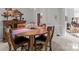A dining area featuring a round wood table, wood chairs, a sideboard, and a decorative wall hanging at 1525 Valhalla Dr, Denver, NC 28037