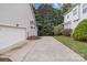 Long driveway leading to a two-car garage of a well-maintained property at 1525 Valhalla Dr, Denver, NC 28037