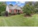 Charming traditional home with manicured lawn and beautiful landscaping at 1525 Valhalla Dr, Denver, NC 28037