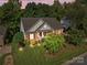 Beautiful brick home featuring a well-manicured lawn and vibrant landscaping at 1525 Valhalla Dr, Denver, NC 28037