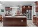 A kitchen featuring an island with a stainless steel sink, granite countertops, and stainless steel appliances at 1525 Valhalla Dr, Denver, NC 28037
