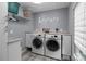 Functional laundry room with modern appliances, ample storage, and a clean, organized layout at 1525 Valhalla Dr, Denver, NC 28037